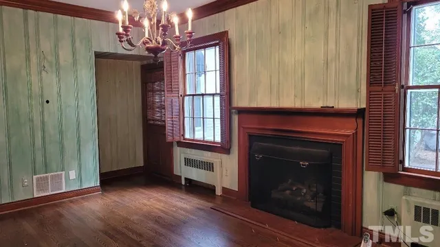 a kitchen with a stove a sink and a microwave