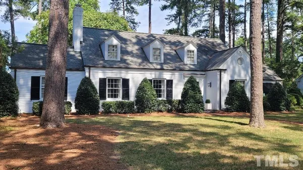 a view of a park with large trees