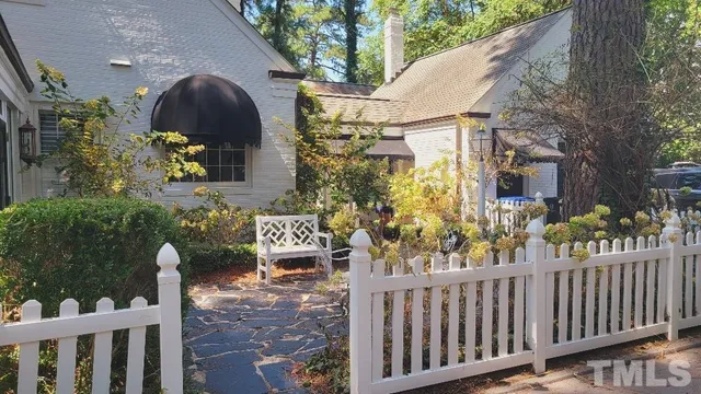 a view of a room with wooden floor and staircase