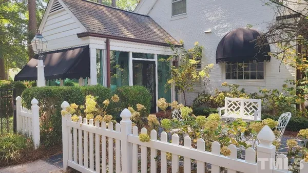 a bathroom with a granite countertop sink toilet a mirror and shower