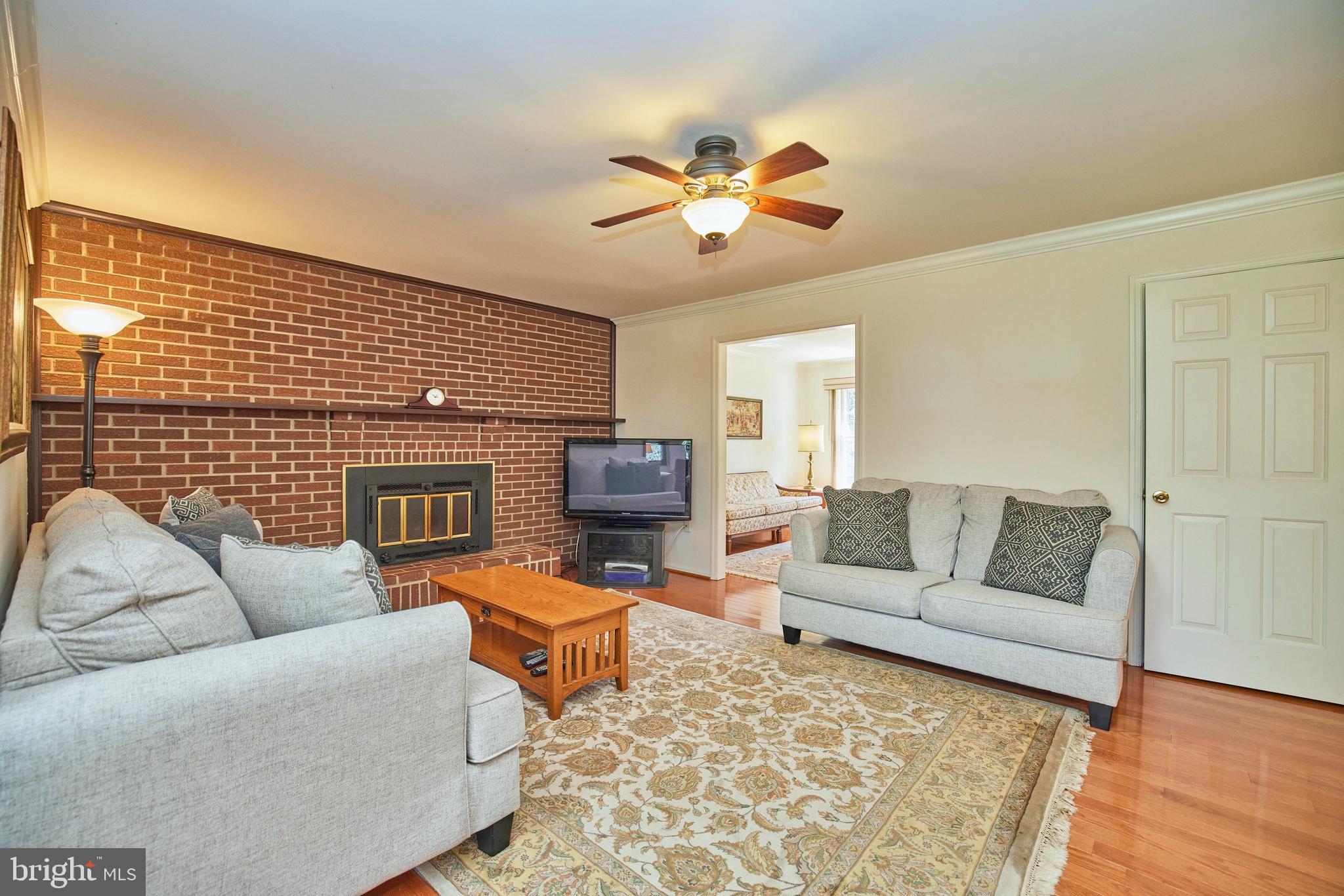 9004 Ridge Lane Vienna, VA 22182 - Photo 9 of 47 Wood fireplace with brick surround & raised hearth