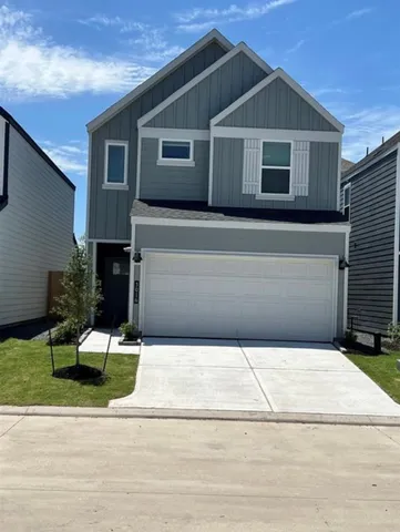 a front view of a house with garage