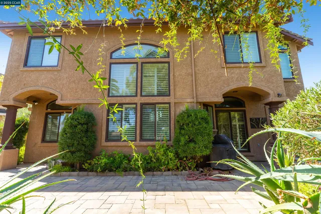 a view of a bedroom with chandelier and entryway