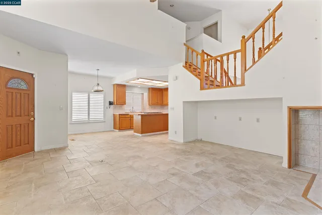 a front view of a building with a garden