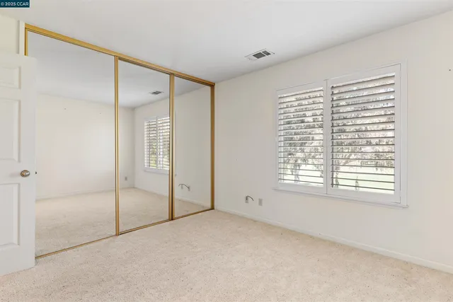 a spacious bathroom with a sink and a mirror