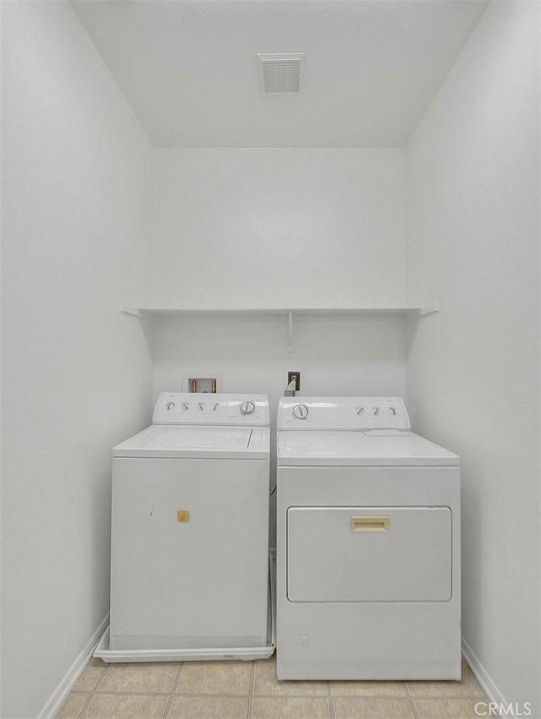 8150 West Preserve Loop Chino, CA 91708 - Photo 28 of 51 a utility room with dryer and washer