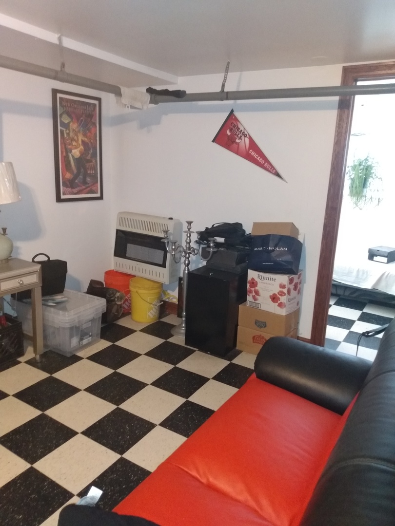 8015 South May Street Chicago, IL 60620 - Photo 15 of 23 a storage & utility room with a black white checkered floor