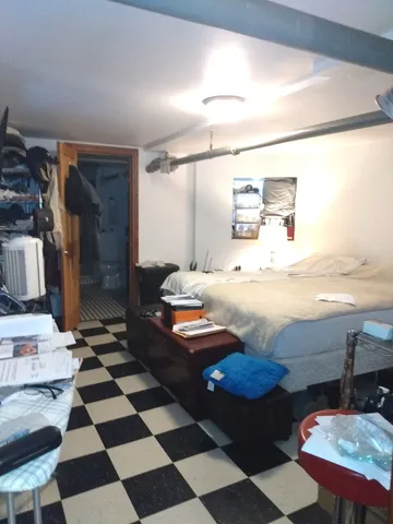 a living room with a gaming machine and a view of living room