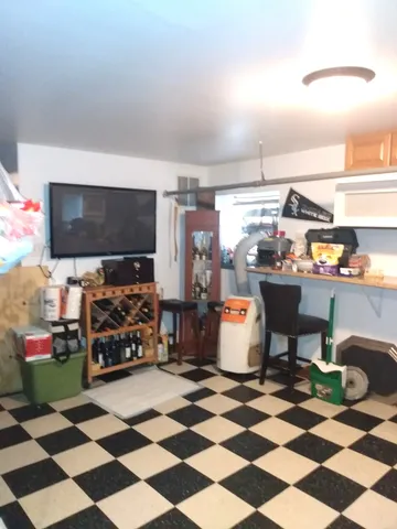 a bathroom with a sink a toilet and shower curtain