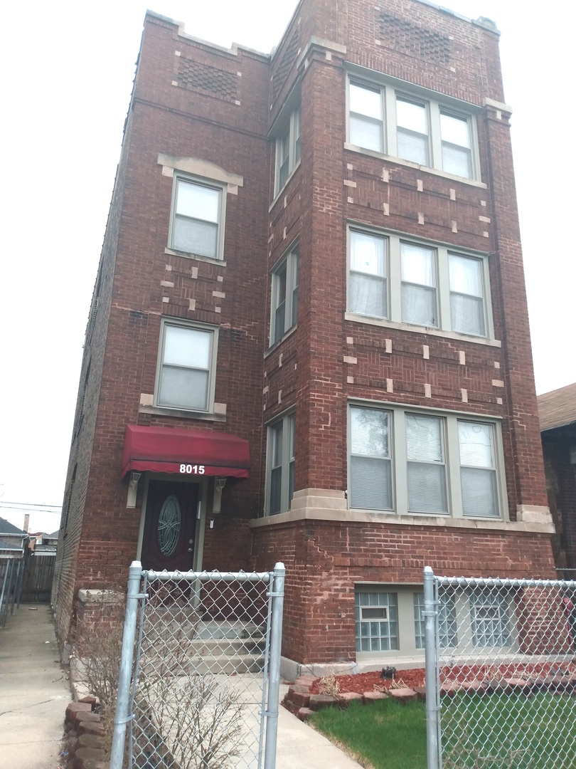 8015 South May Street Chicago, IL 60620 - Photo 2 of 23 a front view of a multi story residential apartment building