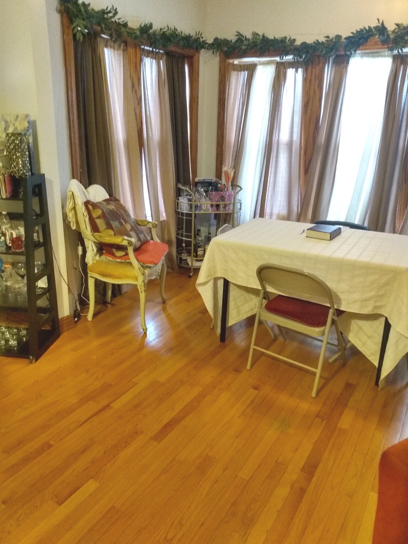 8015 South May Street Chicago, IL 60620 - Photo 3 of 23 a room with furniture and a window