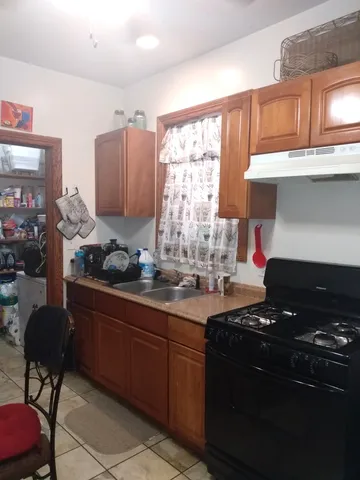 a kitchen with a stove and a refrigerator