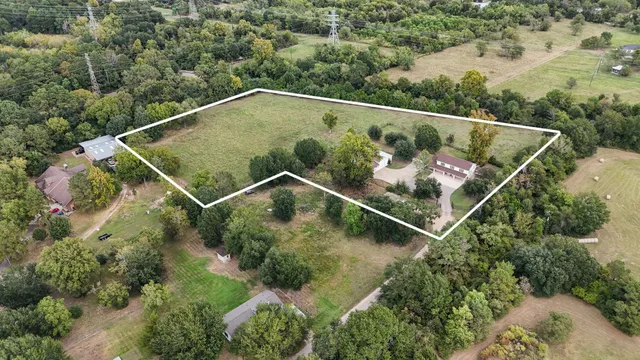 an aerial view of house with outdoor space