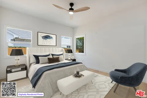 a bedroom with a bed and a couch