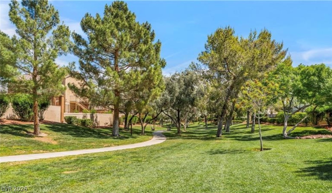 2053 Quarry Ridge Street, Unit 201 Las Vegas, NV 89117 - Photo 21 of 21 A tranquil pathway meanders through a verdant park, offering a peaceful retreat.