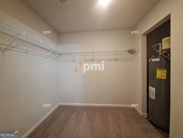 a view of an empty walk in closet