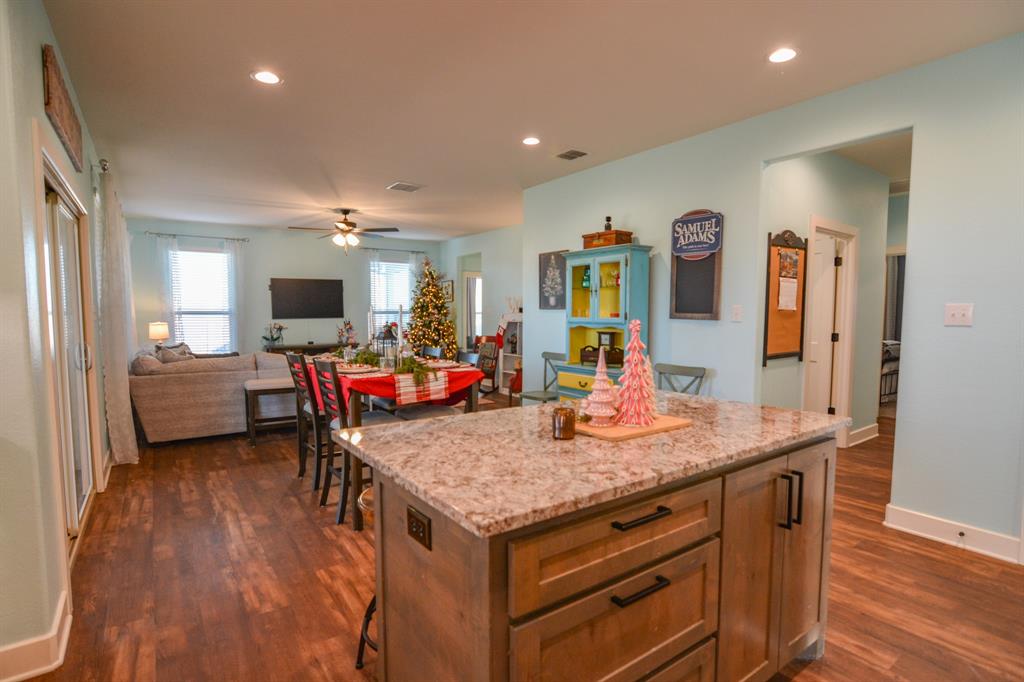 601 Mathew Street Grandview, TX 76050 - Photo 11 of 40 a room with furniture and wooden floor