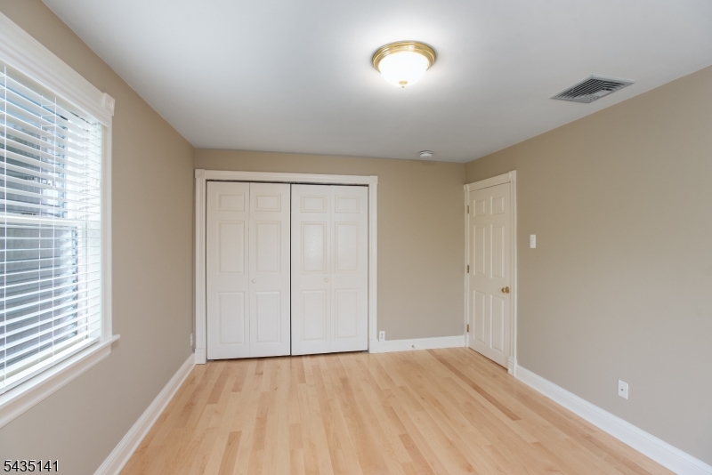 14 Locust Street Madison, NJ 07940 - Photo 21 of 33 wooden floor in an empty room with a window