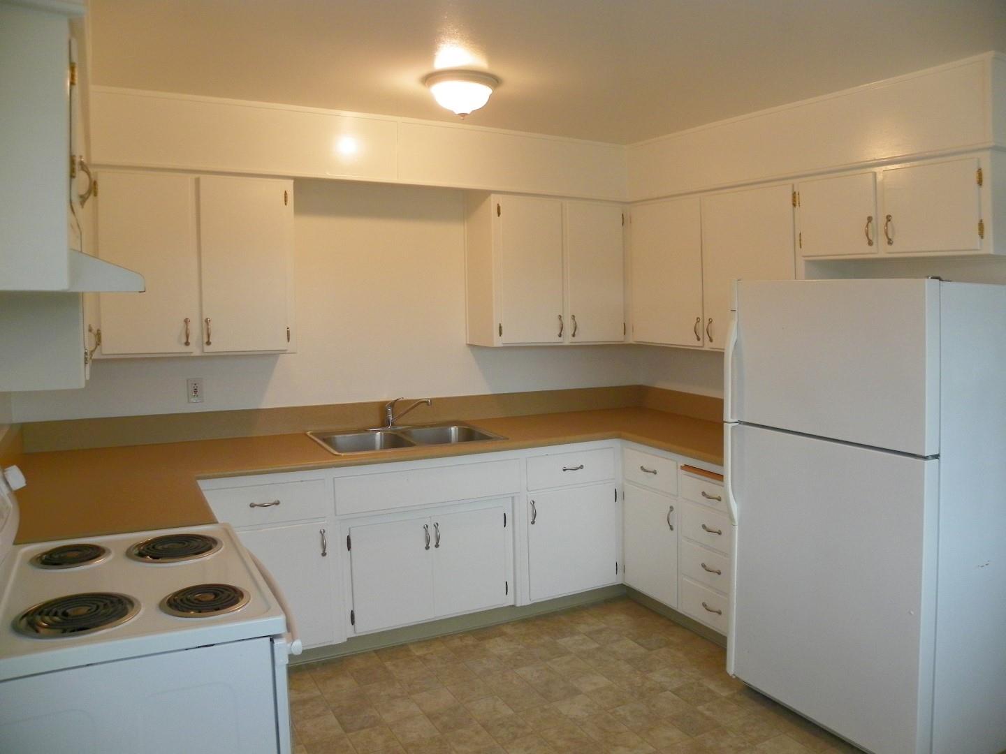 5098 Wilder Drive Soquel, CA 95073 - Photo 11 of 17 a kitchen with cabinets a sink and white stainless steel appliances