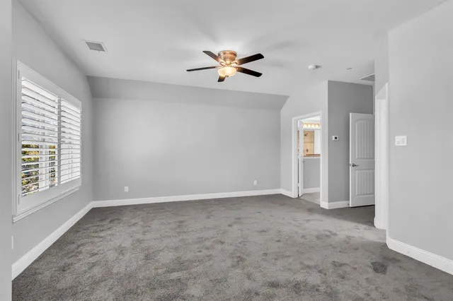 a bathroom with a granite countertop sink mirror and bathtub