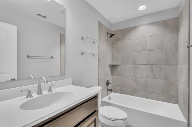 a stove top oven sitting inside of a kitchen