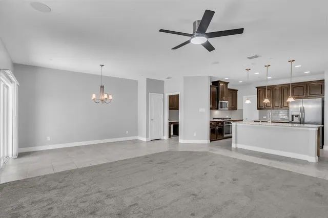 a view of a room with window chandelier