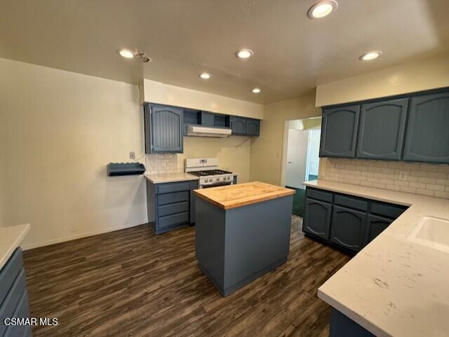 94 Reposo Drive Oak View, CA 93022 - Photo 3 of 18 a kitchen with wooden cabinets and a sink