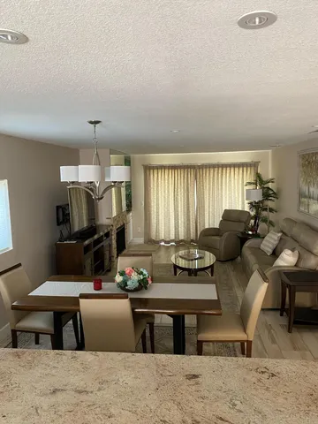 a living room with furniture window and a table