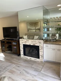 a open kitchen with a stove and a sink