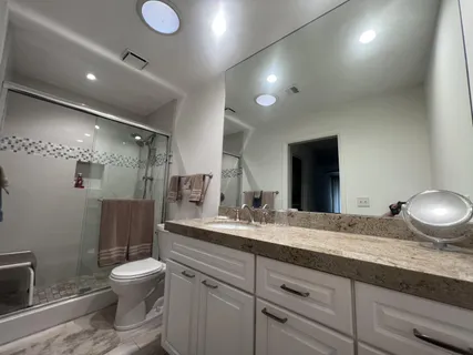 a bedroom with a bed and a television