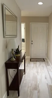 a room that has a sink and a mirror in it