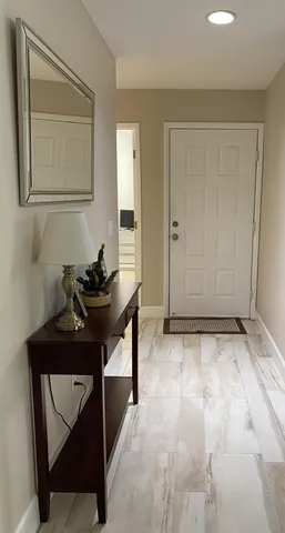 a room that has a sink and a mirror in it