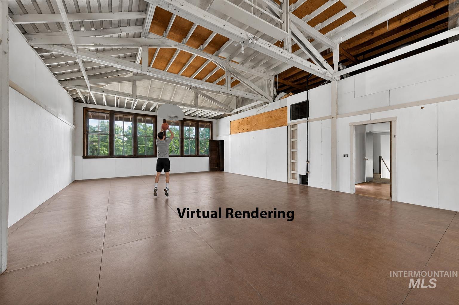 2160 South Five Mile Road Boise, ID 83709 - Photo 11 of 41 Expansive open space featuring high vaulted ceilings with exposed beams, wood-finish flooring, and multiple large windows with dark wood trim