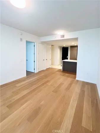 a view of a room with kitchen and sink