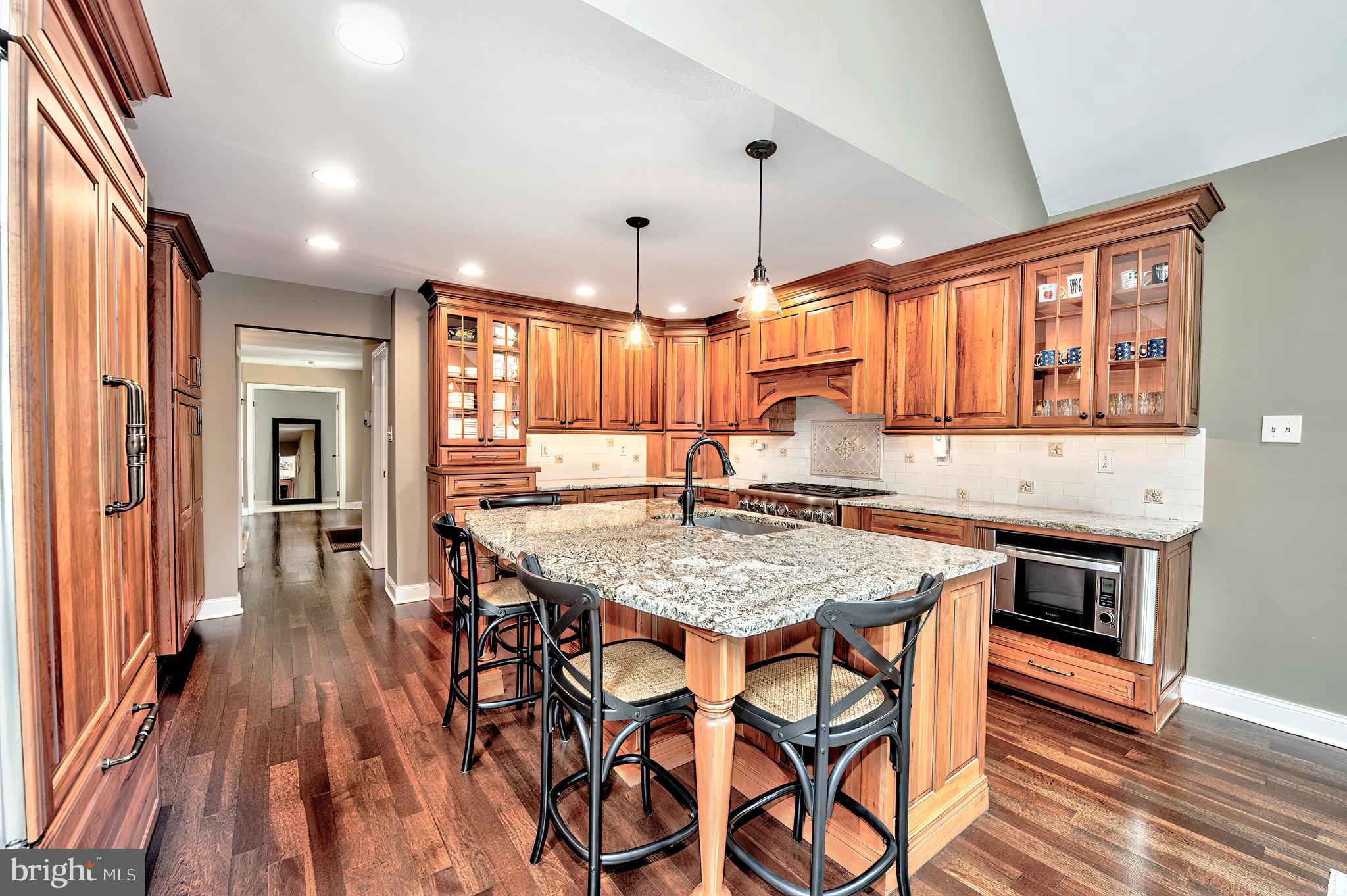 2 Ringneck Lane Wayne, PA 19087 - Photo 16 of 42 an open kitchen with a table and chairs in it