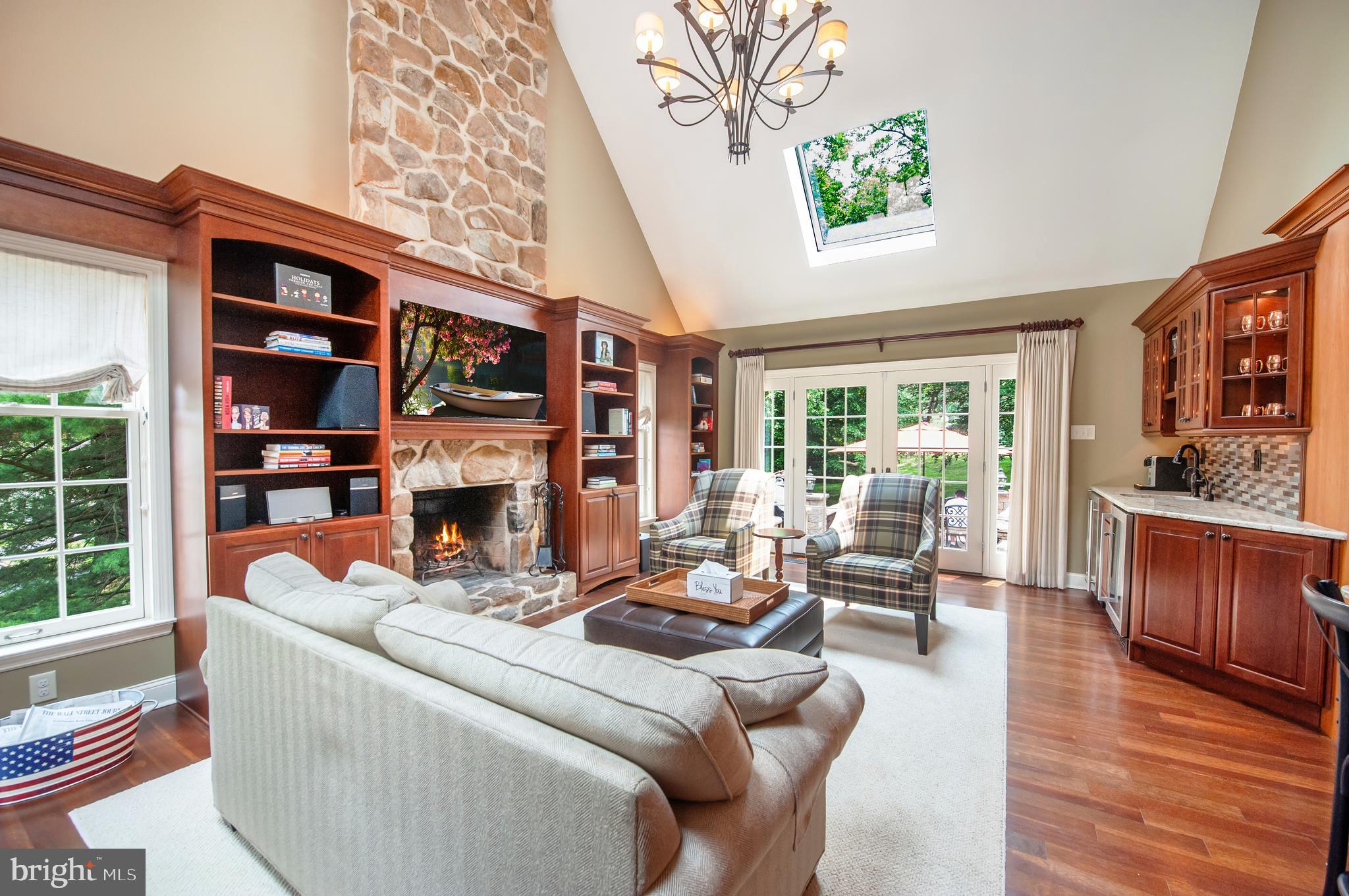 2 Ringneck Lane Wayne, PA 19087 - Photo 17 of 42 a living room with fireplace furniture and a large window