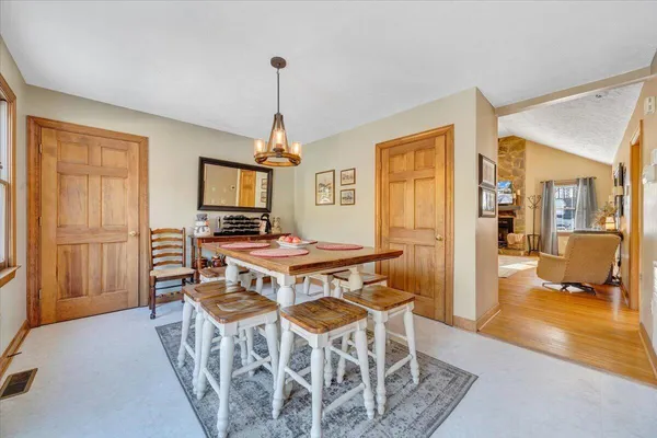 a dining room with furniture and window
