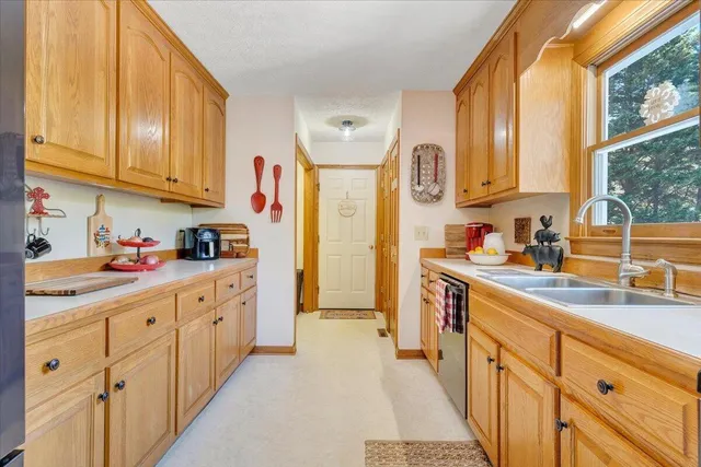 a kitchen with stainless steel appliances granite countertop a refrigerator and cabinets