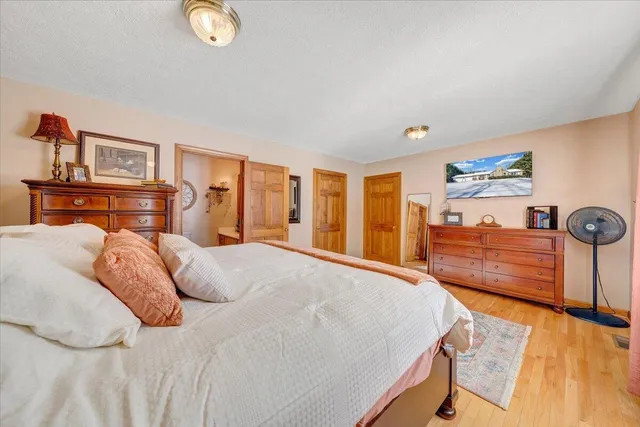 a bedroom with furniture and a window