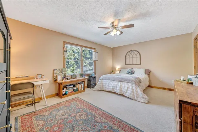 a view of a room with a table and chairs