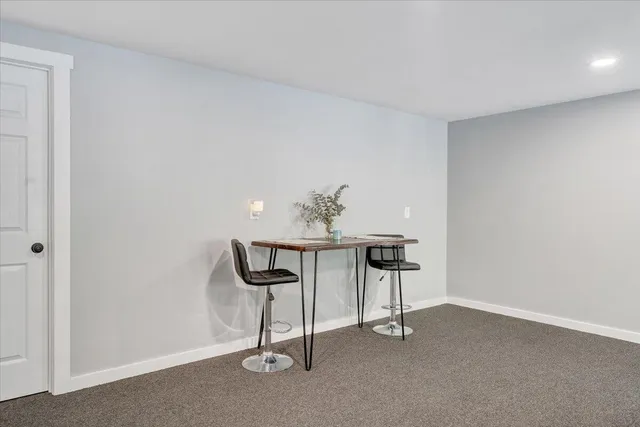 a view of a livingroom with a couch and a ceiling fan