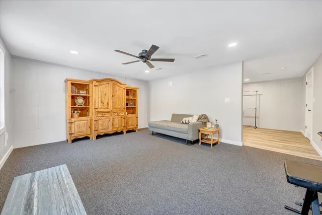 a view of a house with a yard and sitting area