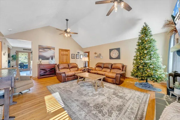 a living room with furniture and a flat screen tv