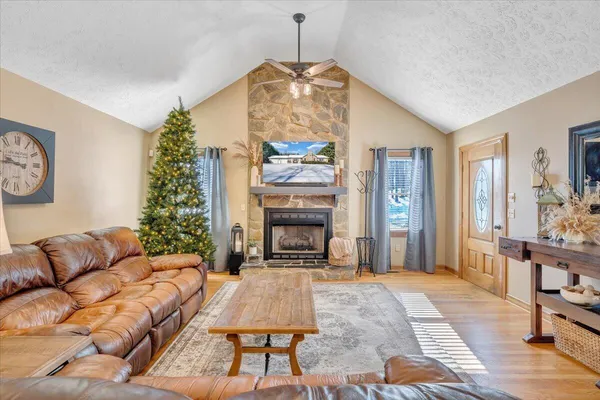 a living room with furniture and a fireplace