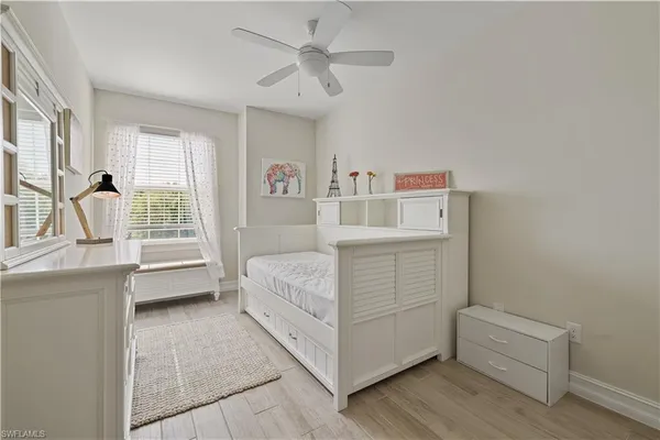 a room with a bed and a window