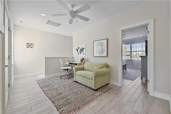 a living room with furniture and a rug