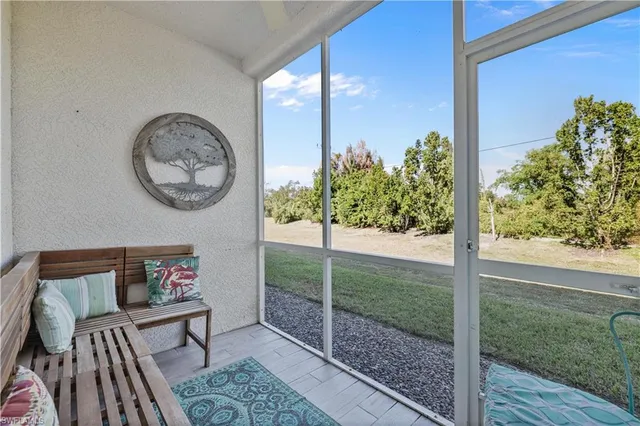 a view of a room with a table and chairs