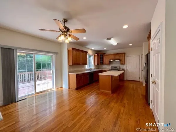 a kitchen view with a sink stainless steel appliances and cabinets