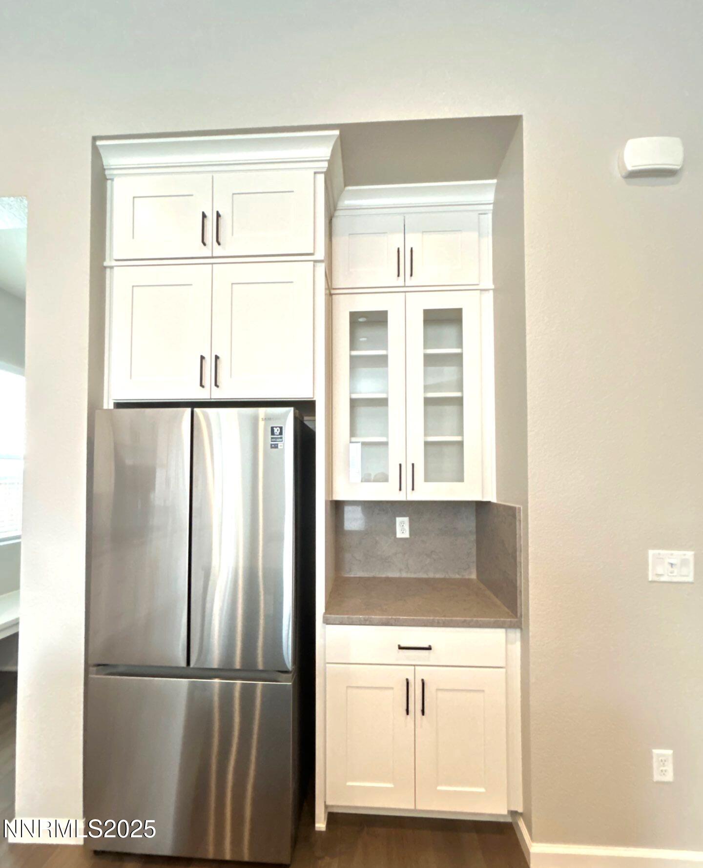 9515 Baldacci Court Reno, NV 89521 - Photo 5 of 27 a kitchen with a refrigerator and a sink