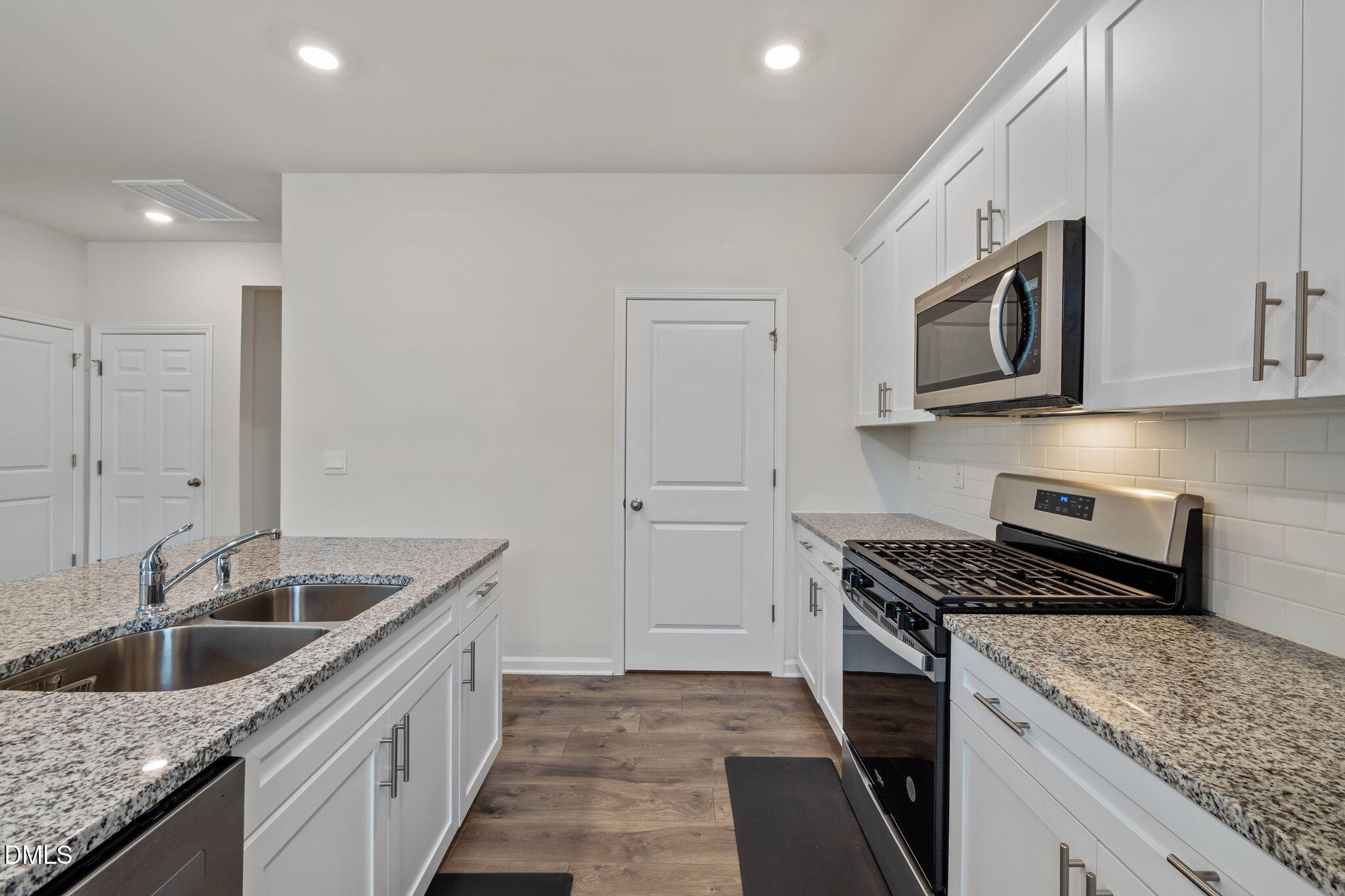 2113 Fletchers Ridge Drive Durham, NC 27703 - Photo 16 of 54 a kitchen that has a sink and a stove
